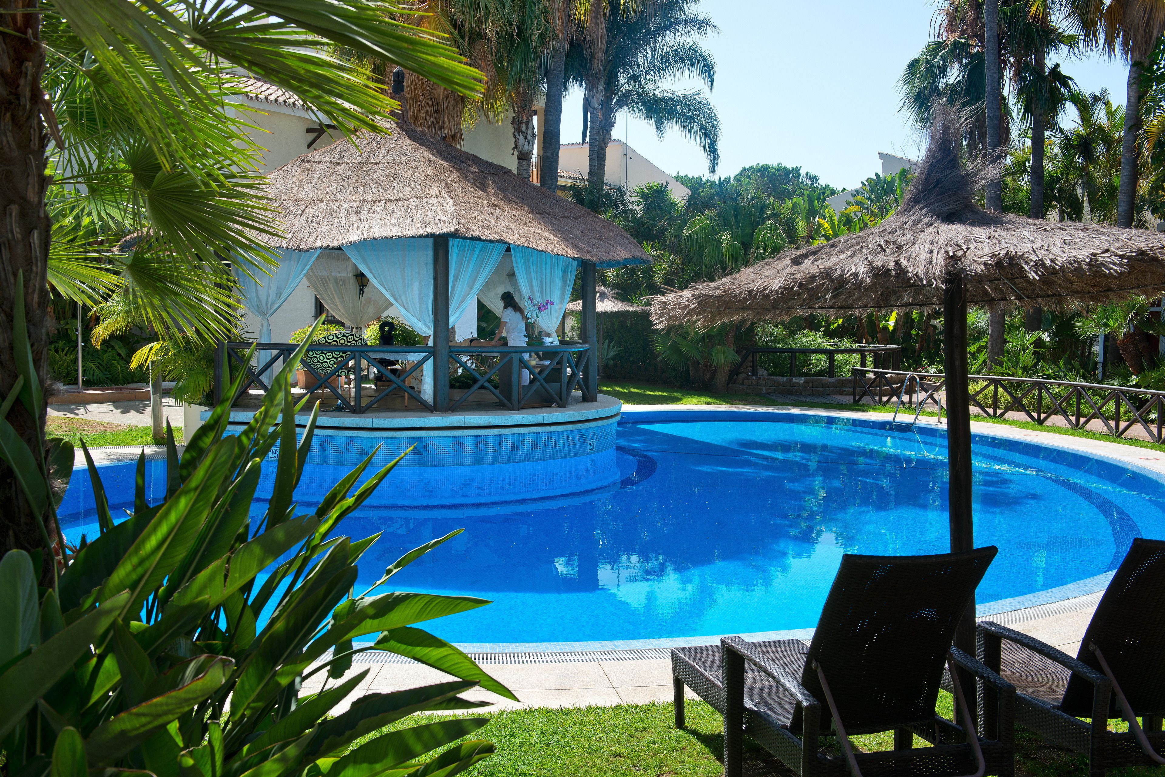 Seasonal outdoor pool, open 11:00 AM to 7:00 PM, pool umbrellas