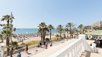 On the beach, sun loungers, beach towels