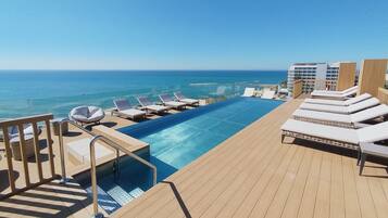 Outdoor pool, pool umbrellas, pool loungers