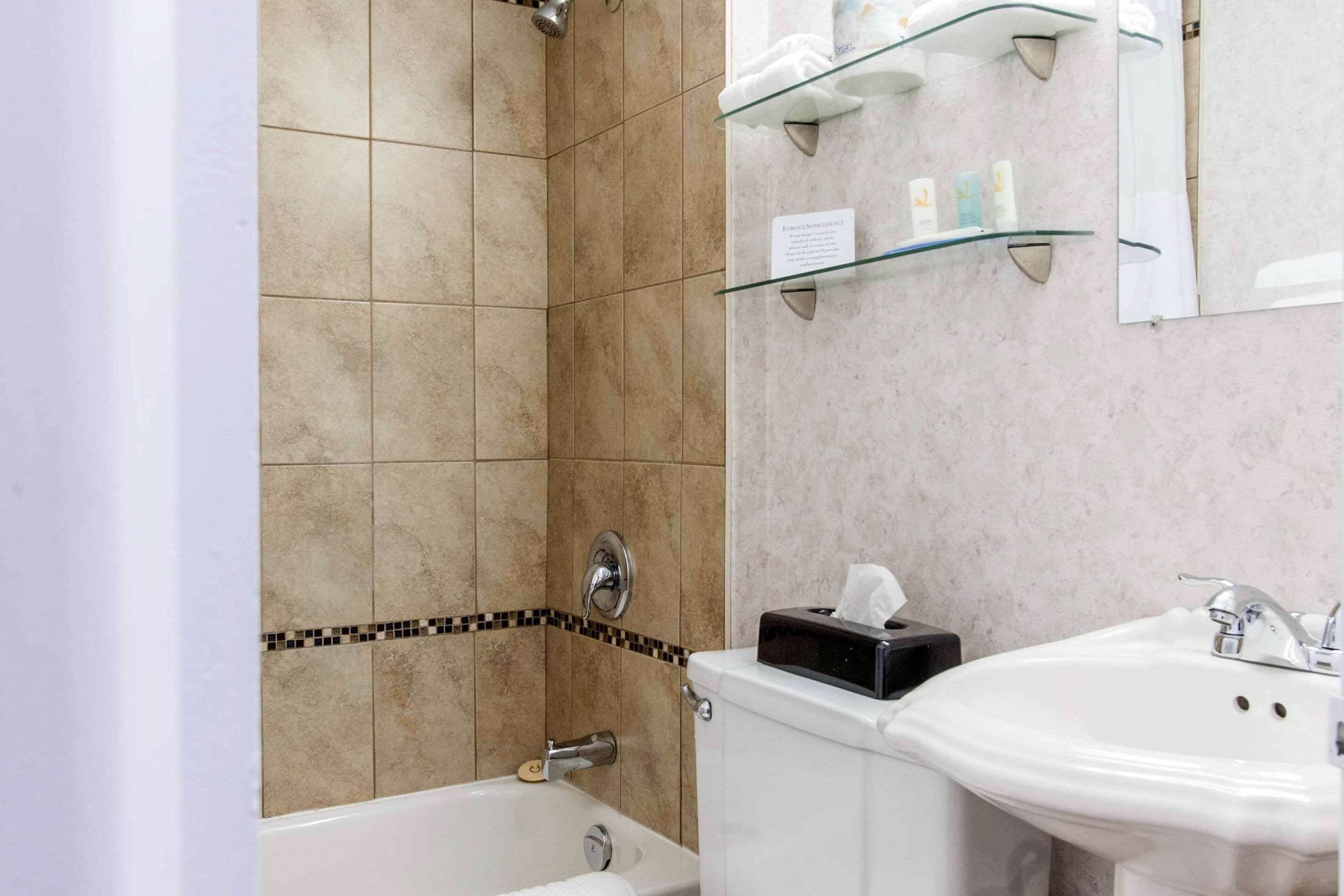 standard room, 2 queen beds, non smoking | bathroom | combined shower/bathtub, free toiletries, hair dryer, towels