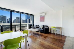 1 Bedroom Apartment | Living area | 32-inch LCD TV with digital channels, TV, DVD player - ULTIQA Little Collins (Melbourne)