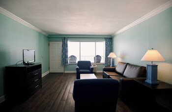 Dunes 2 Queen Beach View Suite | Living room | TV at Boardwalk Beach Hotel