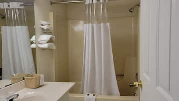 Bathtub, hair dryer, towels, soap