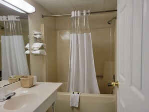Bathtub, hair dryer, towels, soap