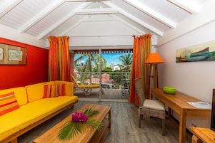 Superior Junior Suite | Living area | 32-inch plasma TV with cable channels, TV