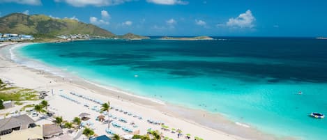 Beach nearby, white sand, beach towels