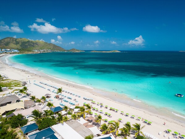 Beach nearby, white sand, beach towels