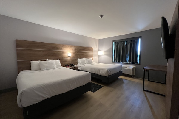 Familie suite, 2 queensize bedden, niet-roken (One-Bedroom) | Luxe beddengoed, een bureau, een laptopwerkplek