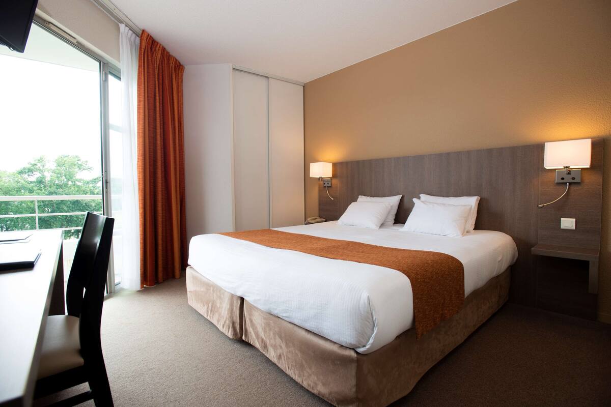 In-room safe, desk, laptop workspace, blackout curtains