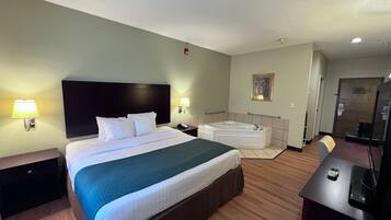 Room, 1 King Bed, Non Smoking (Jetted Tub) | Desk, iron/ironing board, Internet, bed sheets