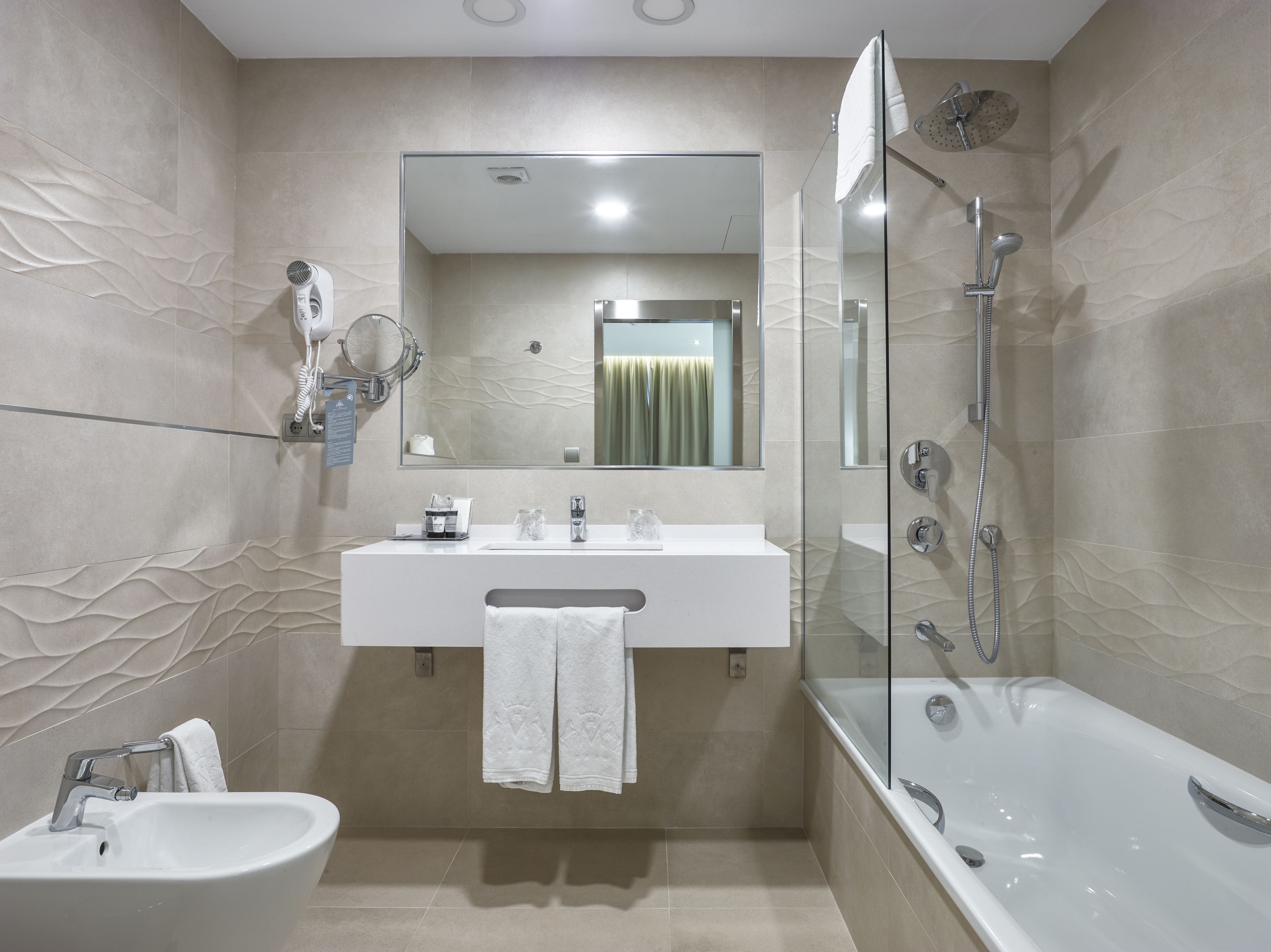 superior double room | bathroom | free toiletries, hair dryer, bidet, towels