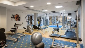 A gym with various exercise equipment, including treadmills, weight machines, and a large exercise ball. - Piccolo Verona (Verona)