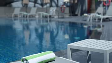 Seasonal outdoor pool, open 9:00 AM to 6:00 PM, pool umbrellas