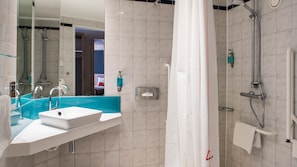 A modern bathroom with a large sink, mirror, and shower. - Holiday Inn Express Oxford-Kassam Stadium by IHG (Oxford)