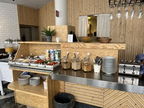 Enjoy a self-service breakfast with a variety of fresh fruits, cheeses, and yogurt, along with juices and smoothies.