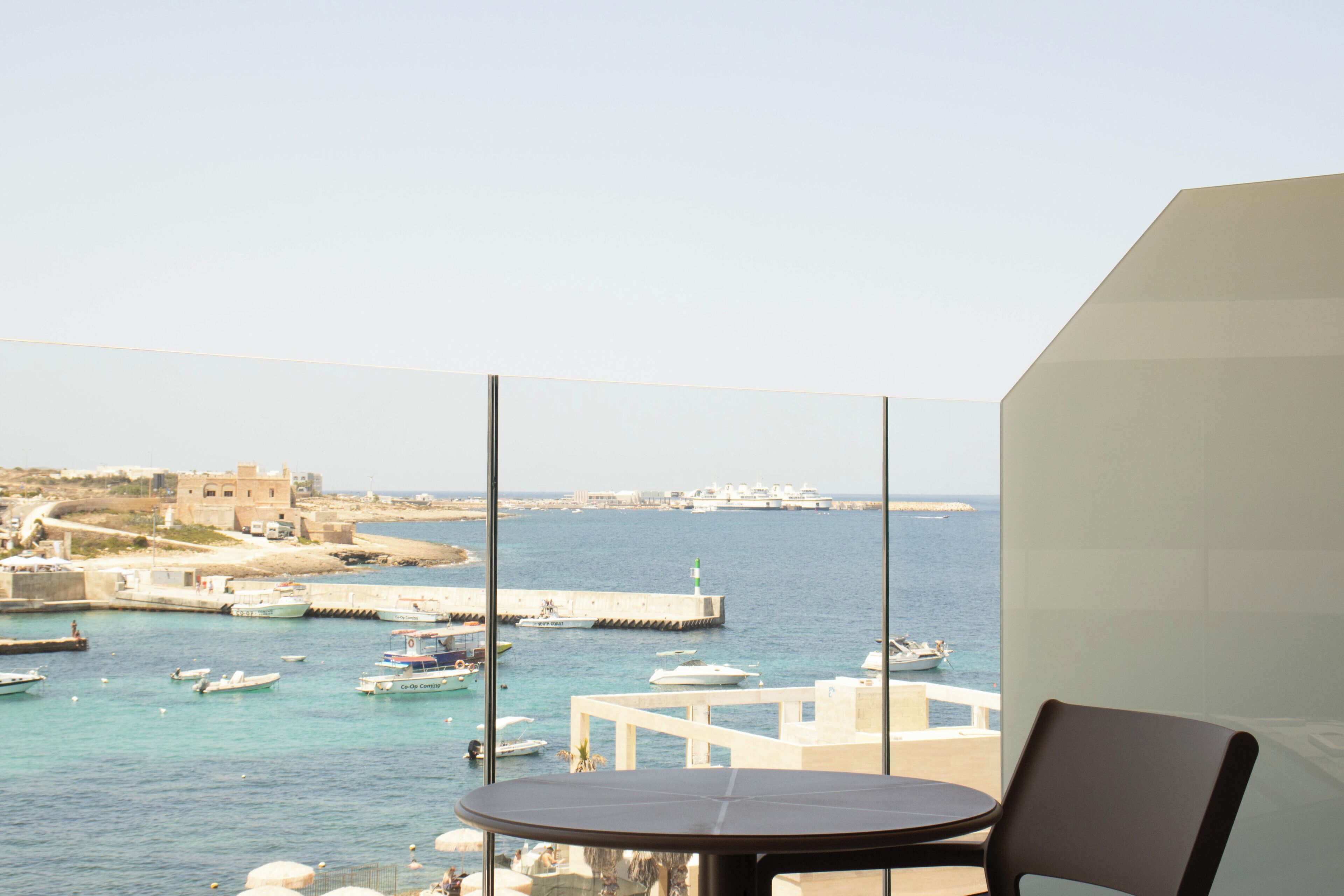 Deluxe Double Room, Sea View | Minibar, in-room safe, desk, laptop workspace