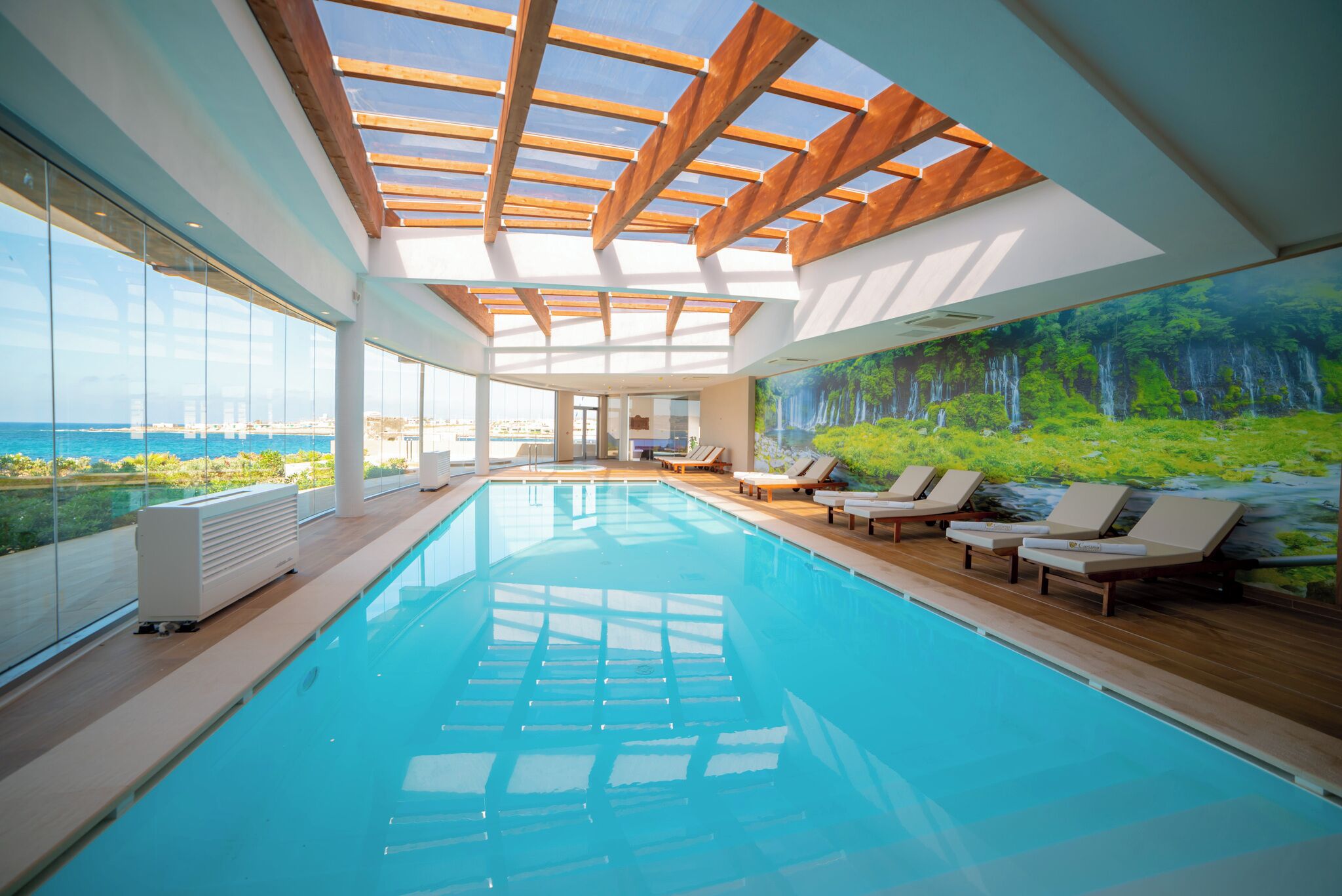 Indoor pool, seasonal outdoor pool, pool umbrellas, pool loungers