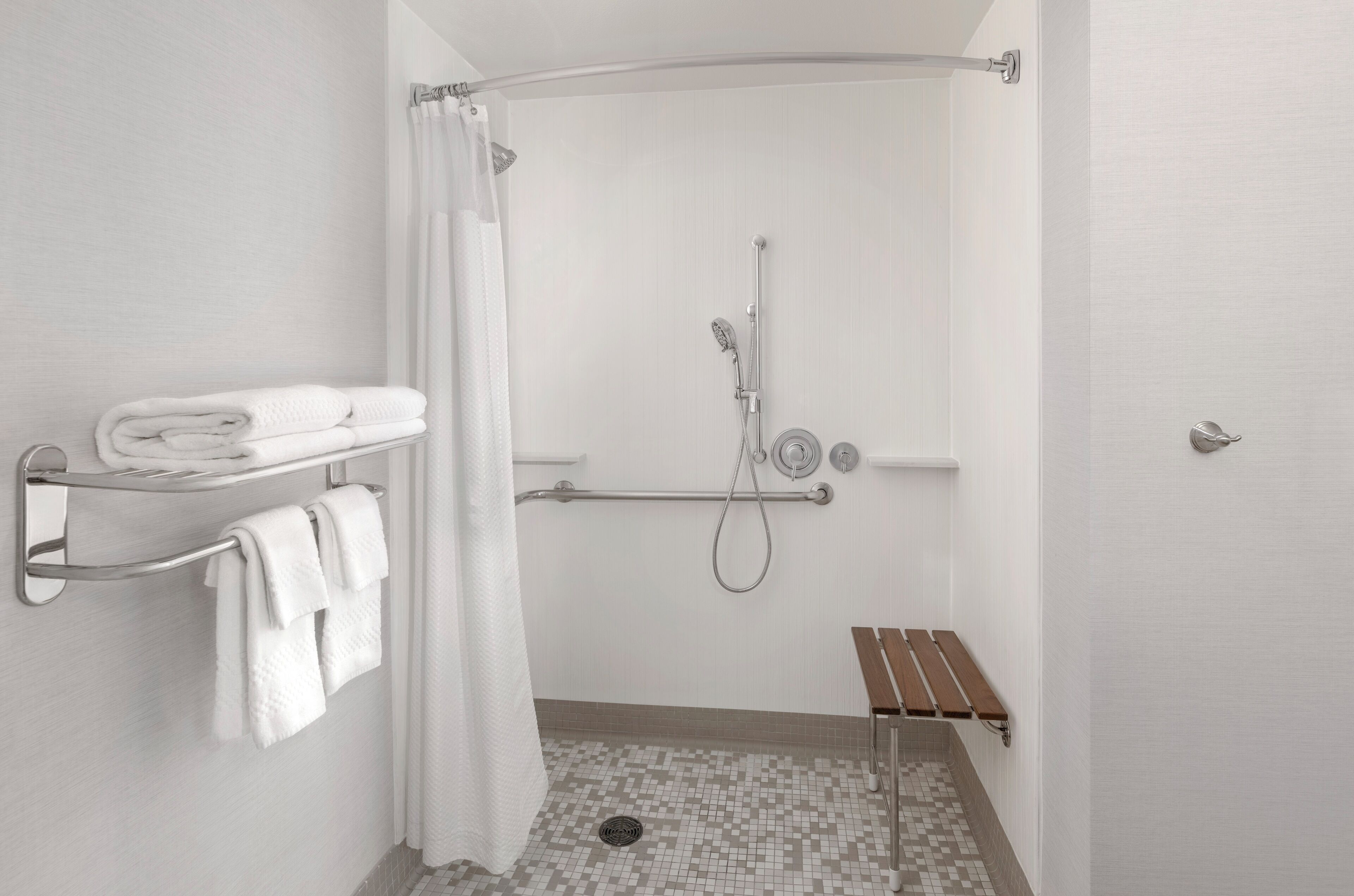 room, 1 king bed, non smoking (mobility/hearing access, roll-in shwr) | bathroom | combined shower/bathtub, free toiletries, hair dryer, towels