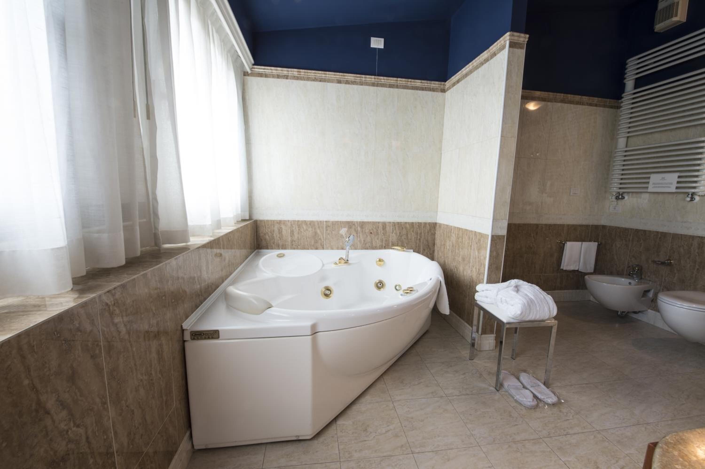 suite | bathroom | shower, hair dryer, slippers, bidet