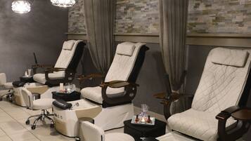 Relax in comfort with reclining chairs and a footrest, perfect for unwinding or a rejuvenating massage.