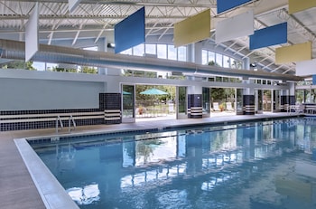 Indoor pool, open 10:00 AM to 7:00 PM, pool umbrellas, sun loungers at Eaglewood Resort and Spa
