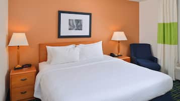 Premium bedding, desk, laptop workspace, blackout drapes