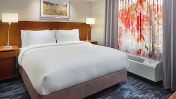 Premium bedding, desk, laptop workspace, blackout curtains