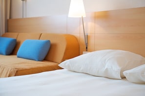 Hypo-allergenic bedding, down comforters, minibar, in-room safe