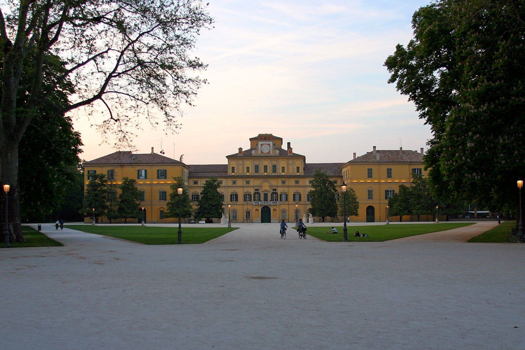 A large building with a symmetrical facade, multiple windows, and a central entrance.