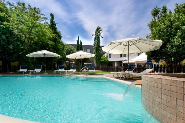 Outdoor pool, pool umbrellas, pool loungers