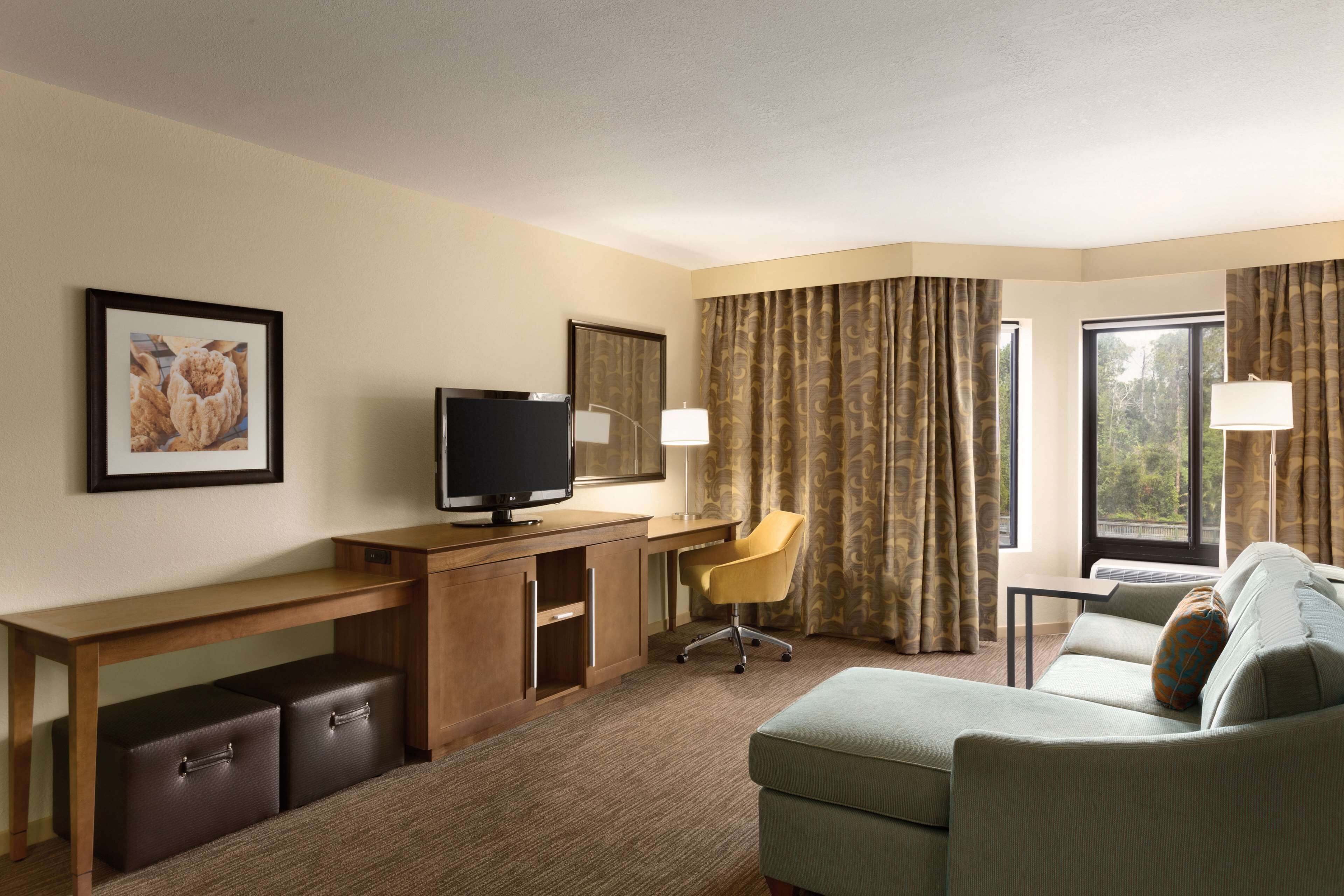 one king suite whirlpool | living area | flat-screen tv