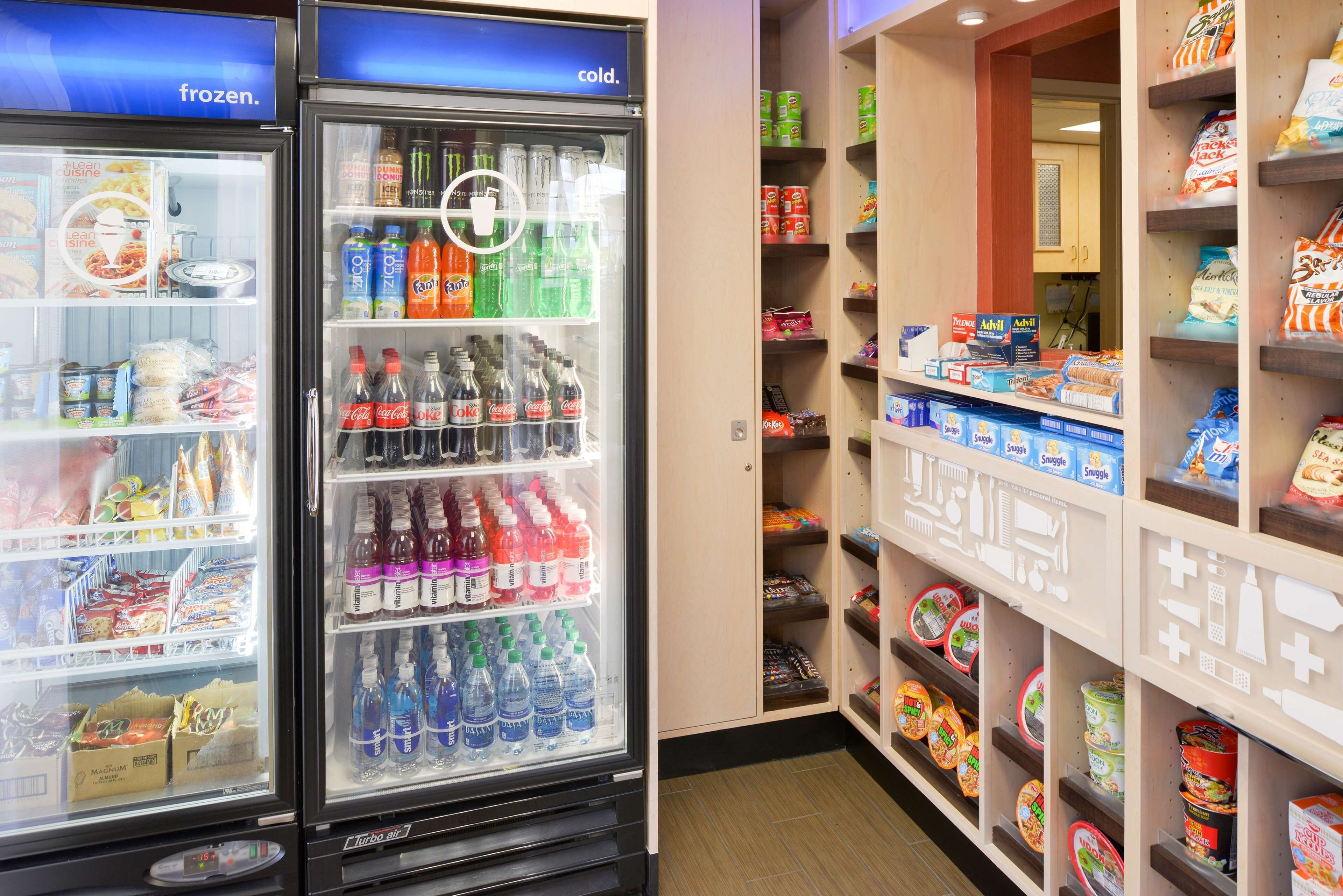 A vending machine area with various snacks and drinks, including Coca-Cola and Fanta.