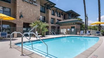 Outdoor pool, open 7:00 AM to 11:00 PM, pool umbrellas, pool loungers