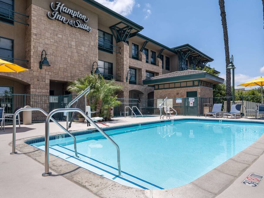 Outdoor pool, open 7:00 AM to 11:00 PM, pool umbrellas, pool loungers