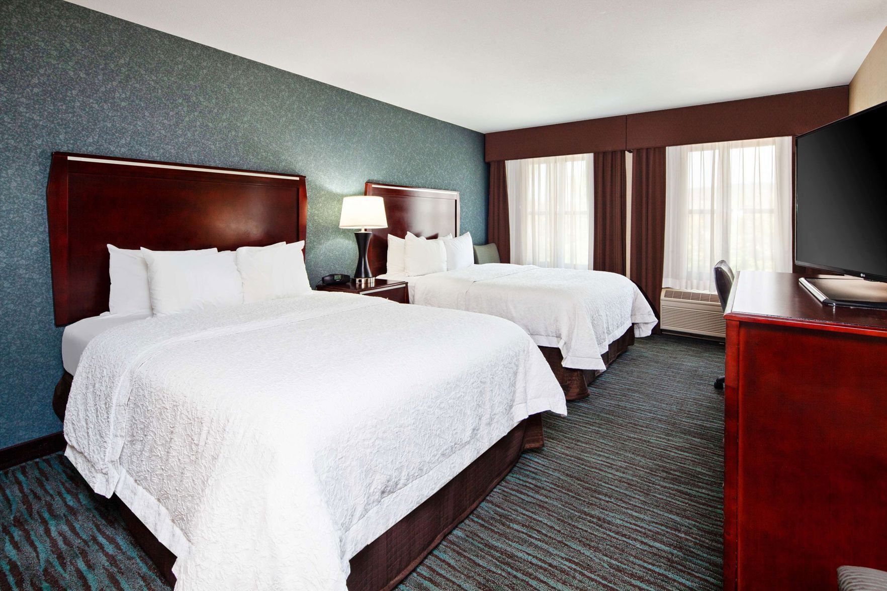 Premium bedding, pillowtop beds, desk, blackout drapes