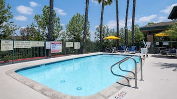 Outdoor pool, open 7:00 AM to 11:00 PM, pool umbrellas, pool loungers