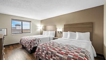 Deluxe Room, 2 Queen Beds, Non Smoking | Desk, blackout drapes, iron/ironing board, free cribs/infant beds