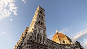 A tall, ornate building with intricate architectural details and a dome. - La Casa del Ghiberti B&B (Florence)