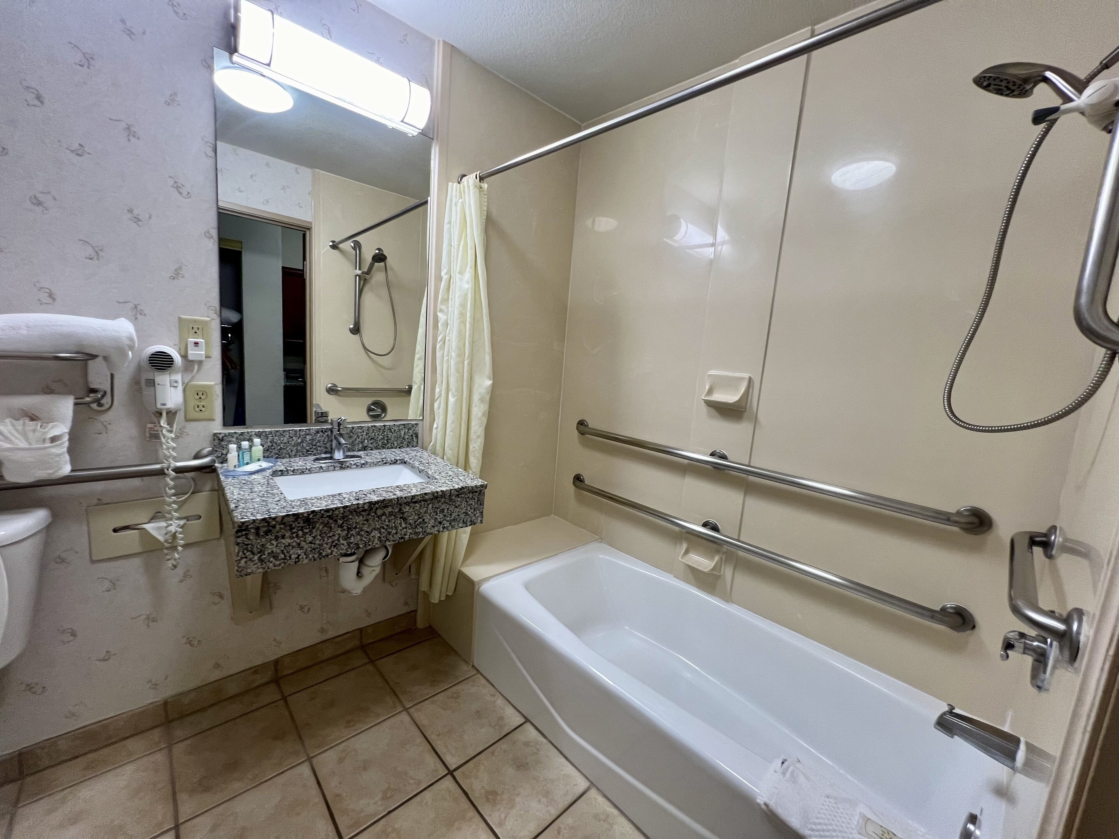suite, 1 queen bed with sofa bed, accessible, non smoking (promotional) | bathroom | combined shower/bathtub, hair dryer, towels