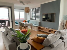 Apartment, 2 Bedrooms, Ocean View | Living area | 68-cm flat-screen TV with digital channels, TV