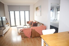 Standard Apartment, 1 Bedroom | Living area | 68-cm flat-screen TV with digital channels, TV