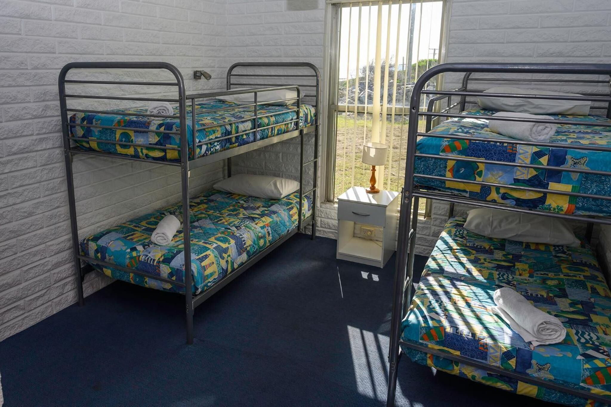 blackout curtains, iron/ironing board, bed sheets