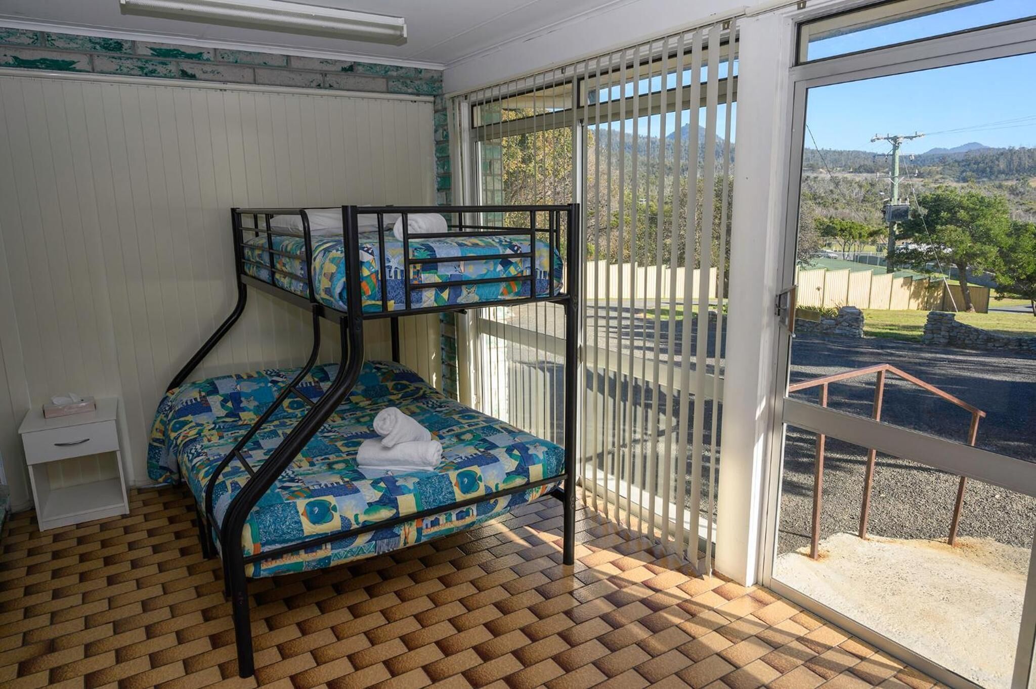 blackout curtains, iron/ironing board, bed sheets