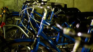 A close-up of a bicycle rack with multiple bicycles.