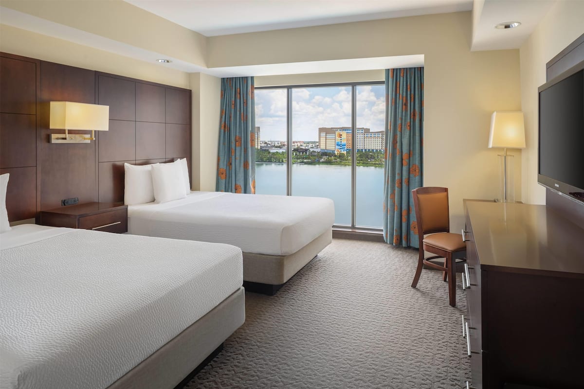 Premium bedding, laptop workspace, blackout drapes, soundproofing