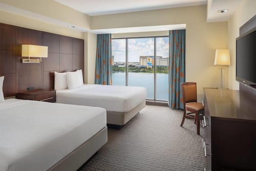 Premium bedding, laptop workspace, blackout drapes, soundproofing