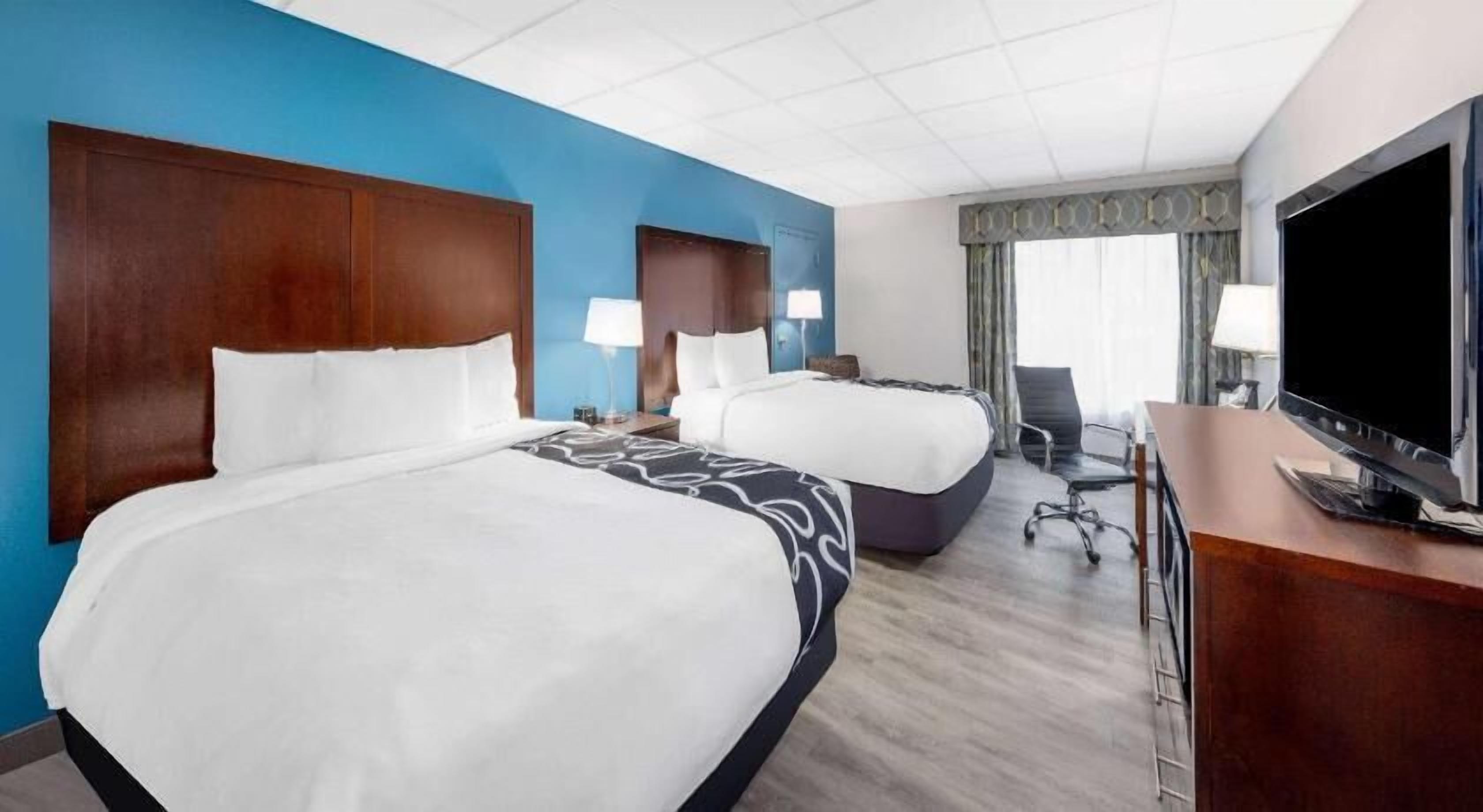 Premium bedding, desk, blackout drapes, iron/ironing board