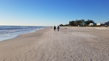 Beach nearby, white sand, sun loungers, beach towels