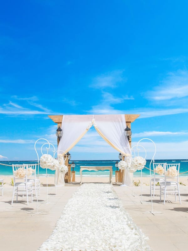 On the beach, white sand, beach towels, beach massages