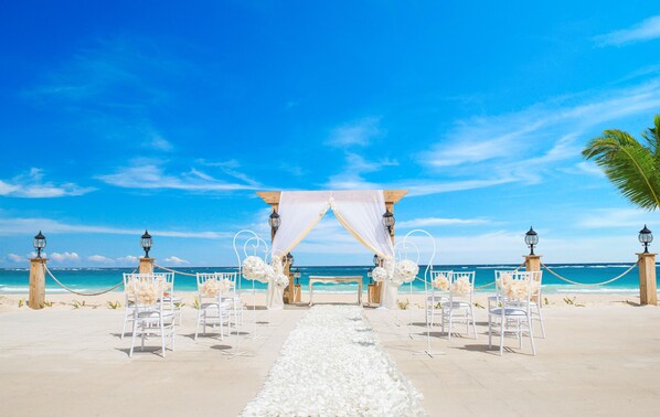 On the beach, white sand, beach towels, beach massages